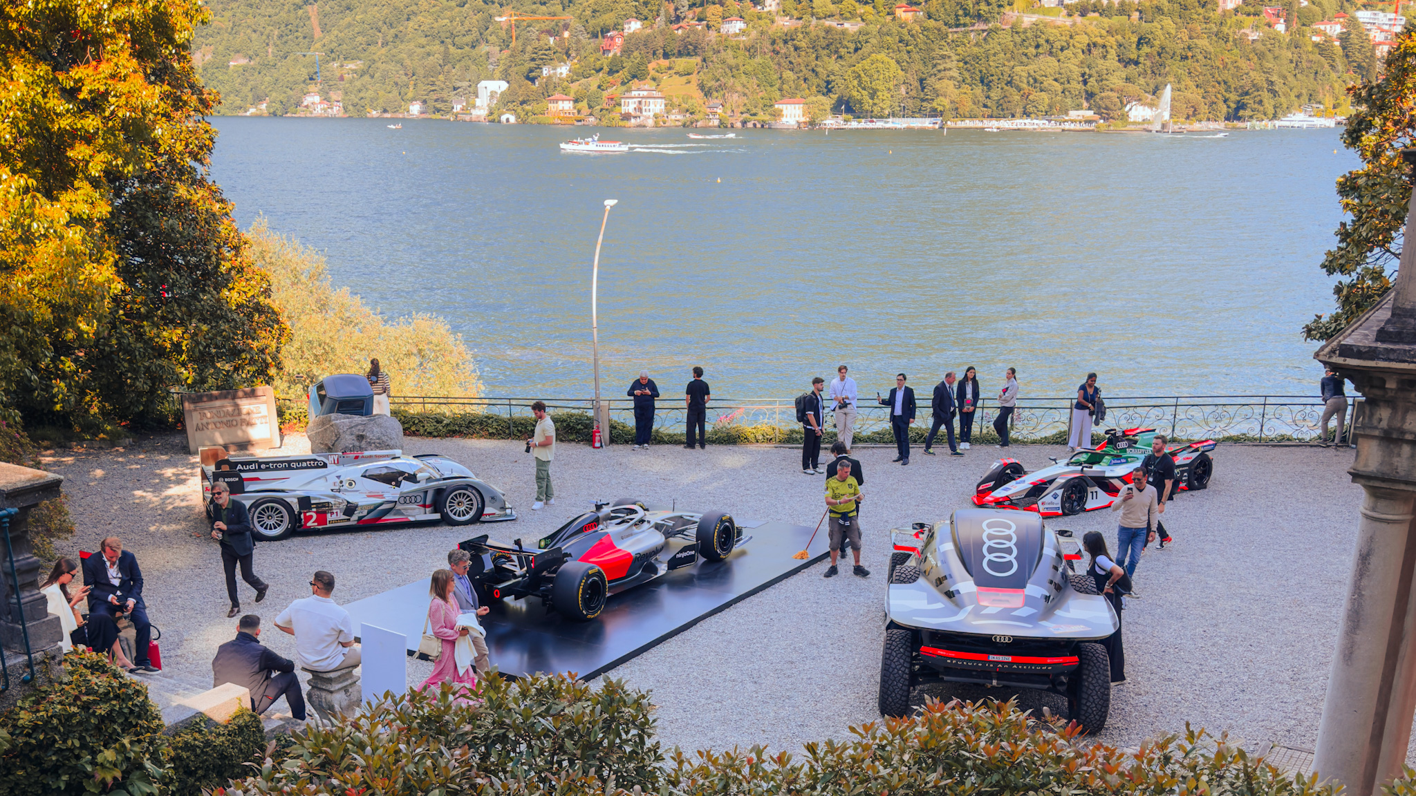 Audi Le Mans cars lined up by the water